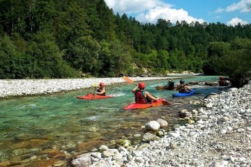 a group of people on kayaks in a body of water